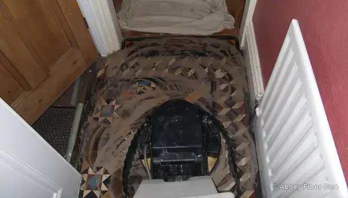 Residue being removed from Victorian clay tiles in Blyth with controlled cleaning and extraction